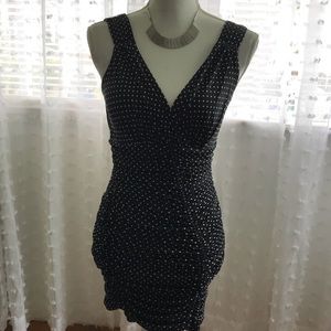 Black dress with white polka dots.